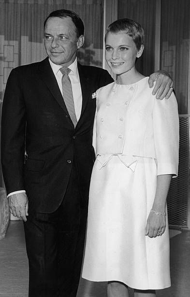 19th july 1966  american singer frank sinatra 1915   1998 stands with his arm around his third wife, actor mia farrow, during their private wedding in las vegas, nevada sinatra wears a suit farrow has close cropped hair and wears a pale colored dress and matching cropped jacket  photo by hulton archivegetty images
