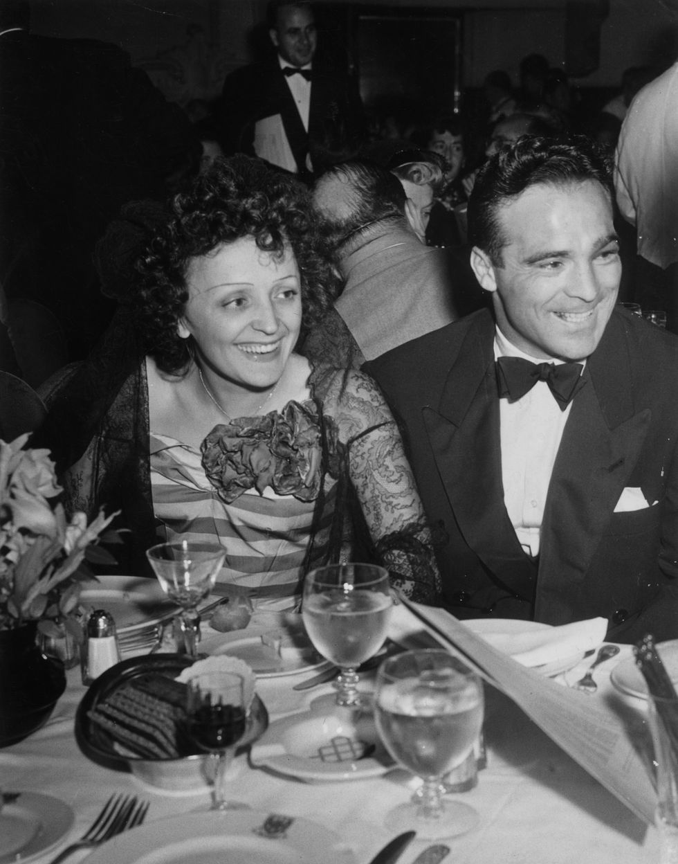 22nd september 1940  french singer edith piaf and french boxer marcel cerdan smile while sitting at a dining table at the versailles nightclub, new york city  photo by hulton archivegetty images