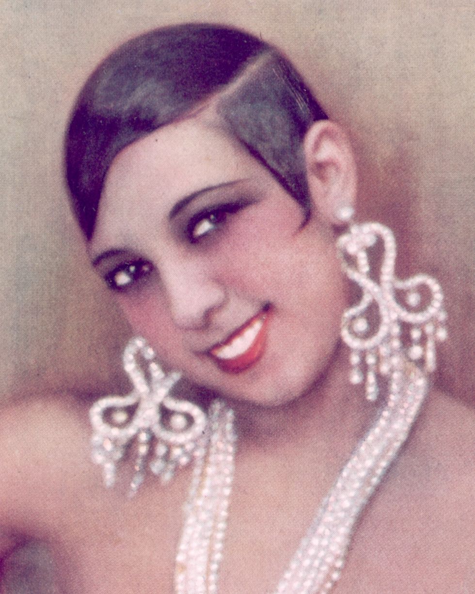 circa 1925  american born singer, dancer, and folies bergere star josephine baker 1906   1975 exposing her breasts in a cabaret costume consisting of rhinestones and feathers the photograph is hand tinted  photo by hulton archivegetty images