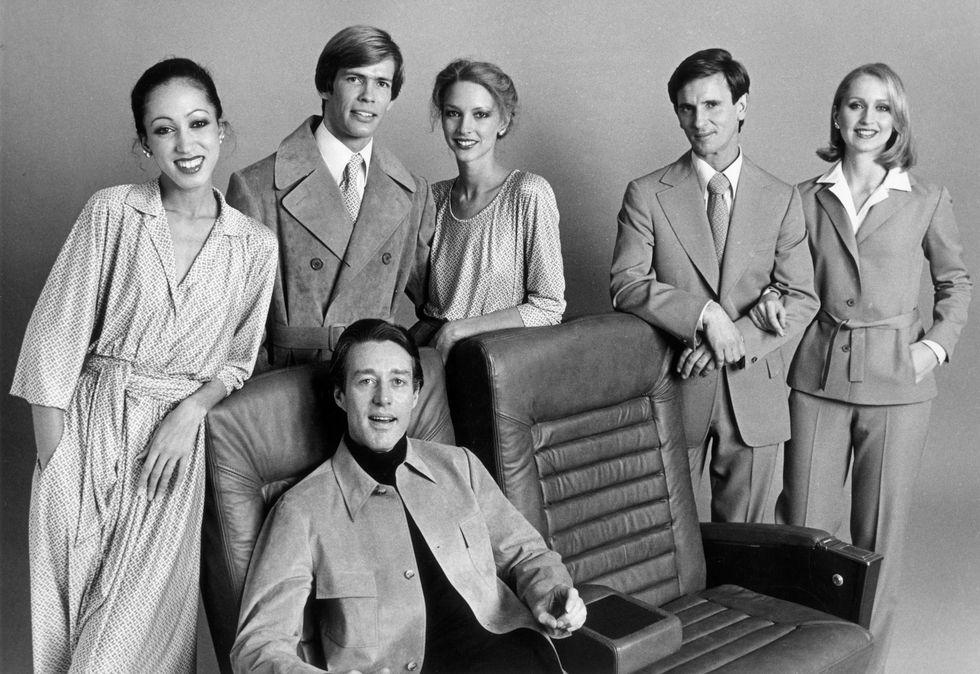 circa 1975  studio portrait of american fashion designer halston roy halston frowick, 1932   1990 sitting in front of models wearing his clothes, which are made from coordinated fabrics  photo by hulton archivegetty images