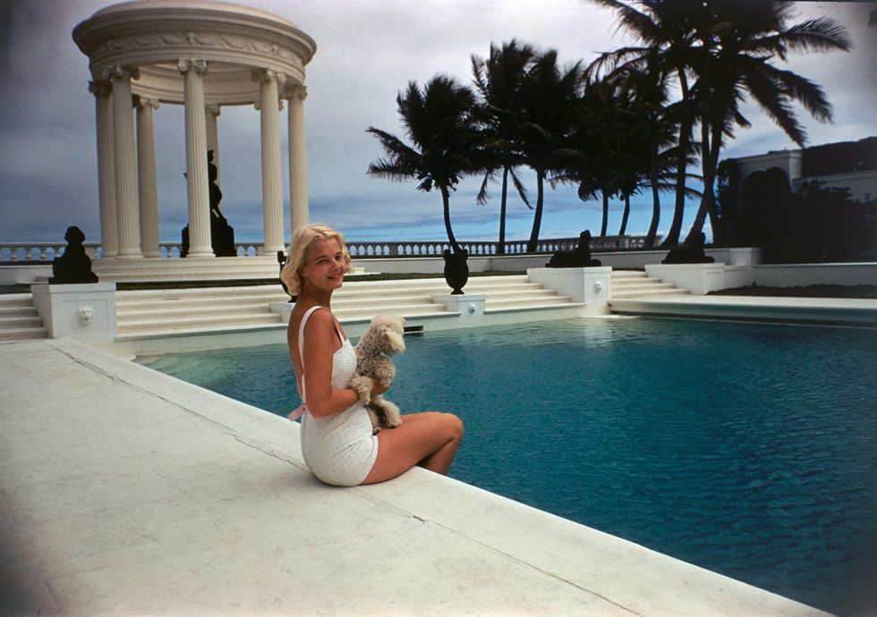 circa 1955 american socialite mrs winston f c guest aka cz guest, 1920 2003 perches on the edge of the grecian temple pool on her ocean front estate, villa artemis, palm beach, florida, 1955 photo by slim aaronsgetty images