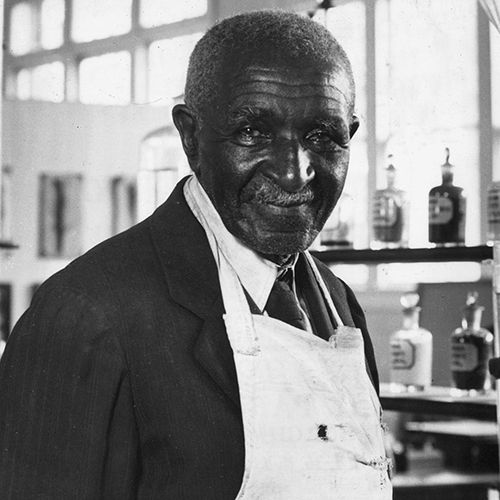 george washington carver in suit and apron