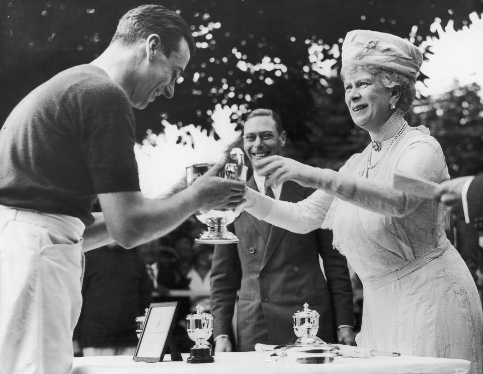 1st july 1931  queen mary 1867   1953, consort to king george v, presenting the duke of yorks polo cup  to louis mountbatten at ranelagh  the duke of york, and future king george vi centre is watching the presentation  photo by central pressgetty images