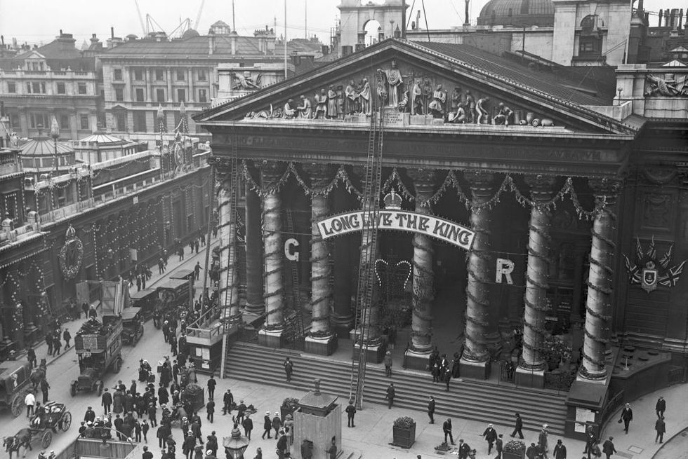 21st june 1911 workmen putting up decorations at the royal exchange to celebrate the coronation of king george v photo by hulton archivegetty images