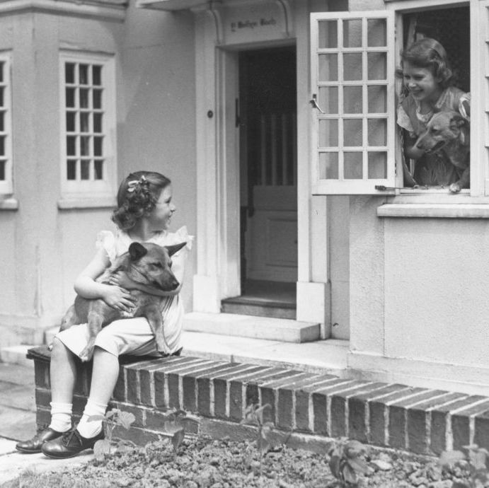 june 1936 princess margaret 1930 2002 left and her sister queen elizabeth ii as princess elizabeth in front of miniature cottage y bwthyn bach the welsh house in the grounds of royal lodge, windsor, with two of their dogs the little house was presented to princess elisabeth and princess margaret by the people of wales in 1931 photo by lisa sheridanstudio lisahulton archivegetty images