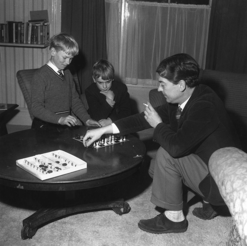 1961  english novelist and poet kingsley amis 1922   1995 with his sons martin and philip playing chess  photo by chris warekeystone featuresgetty images