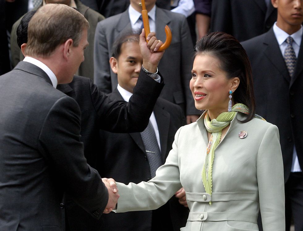 beijing, china  britains prince andrew shakes hands with thai princess ubol ratana r, who was also visiting the forbidden city in beijing 24 april 2004 prince andrew, the duke of york, as britains special representative for international trade and investment, is in china on a six day mission to boost trade and investment with china                                       afp photo  photo credit should read strafp via getty images