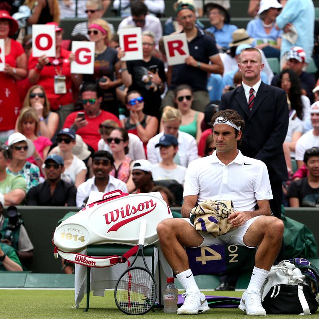 switzerlands roger federer rests between sets during his mens singles first round match against italys paolo lorenzi on day two of the 2014 wimbledon championships at the all england tennis club in wimbledon, southwest london, on june 24, 2014 afp photo  andrew yates    restricted to editorial use        photo credit should read andrew yatesafp via getty images