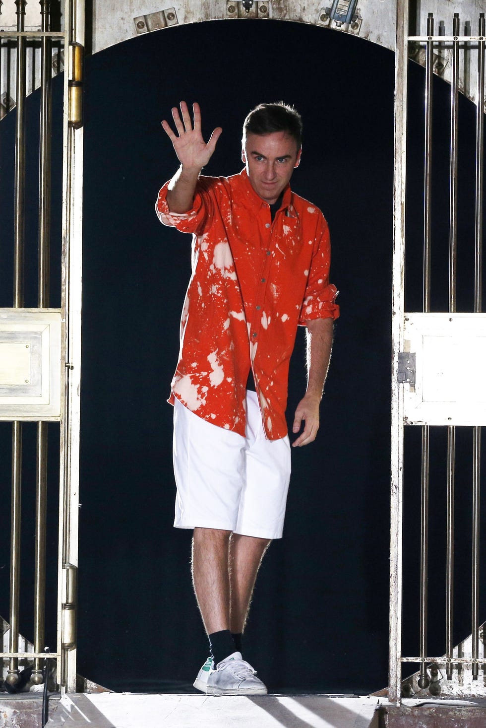belgiums fashion designer raf simons acknowledges the public at the end of his mens 2015 spring/summer fashion show on june 25, 2014 in paris. afp photo / francois guillot (photo credit should read francois guillot/afp via getty images)