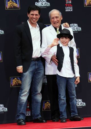 hollywood, ca   september 08  writerdirectoractor mel brooks c and son writer max brooks l and grandson henry michael brooks attend the mel brooks hand and footprint ceremony at the tcl chinese theatre on september 8, 2014 in hollywood, california  photo by david livingstongetty images