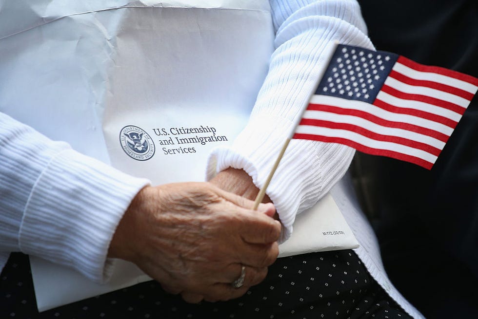 chicago, il september 16 immigrants from 25 countries participate in a naturalization ceremony in daley plaza on september 16, 2014 in chicago, illinois seventy people were awarded their us citizenship at the citizenship day ceremony photo by scott olsongetty images