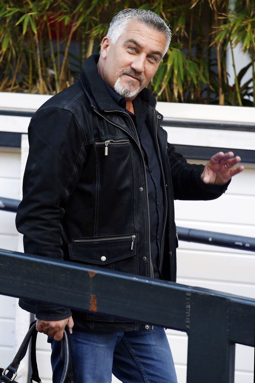 Jacket, Leather jacket, Leather, Standing, Textile, Outerwear, Top, Jeans, Facial hair, Musician, 