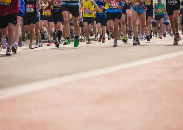 london, england april 17, 2011 marathon runners running towards london bridge in the 2011 london marathon 35,000 contestant took parts in this event