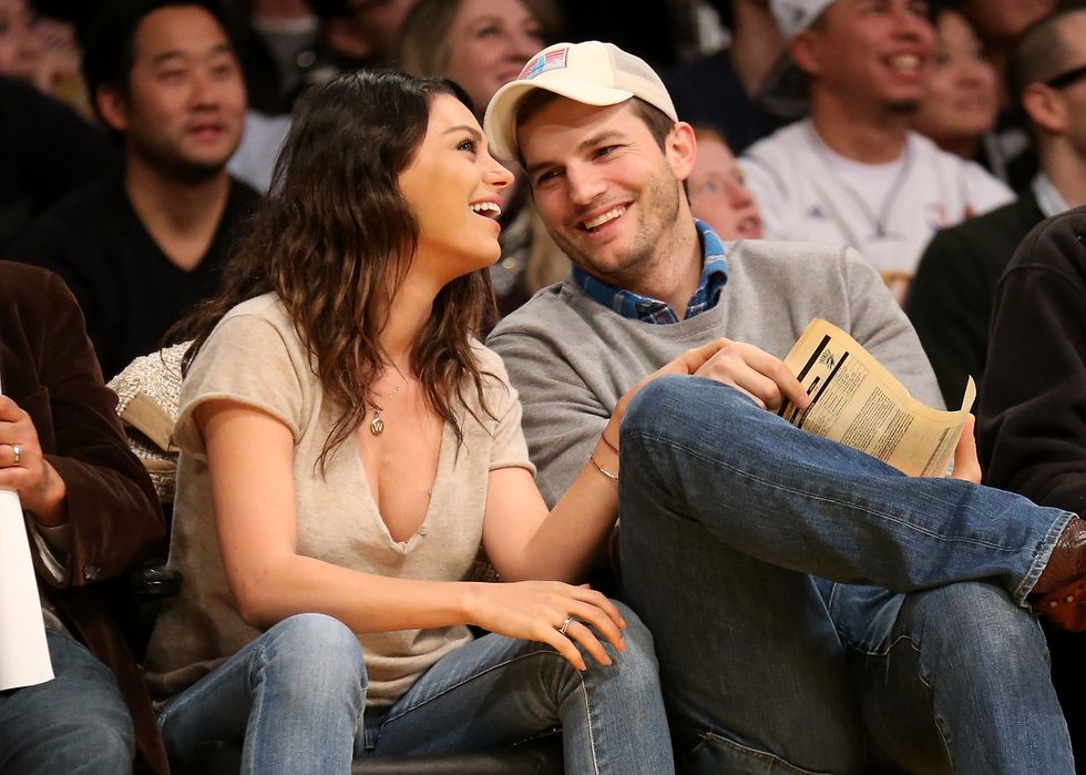 los angeles, ca december 19 actors ashton kucher and mila kunis attend the game between the oklahoma city thunder and the los angeles lakers at staples center on december 19, 2014 in los angeles, california note to user user expressly acknowledges and agrees that, by downloading and or using this photograph, user is consenting to the terms and conditions of the getty images license agreement photo by stephen dunngetty images