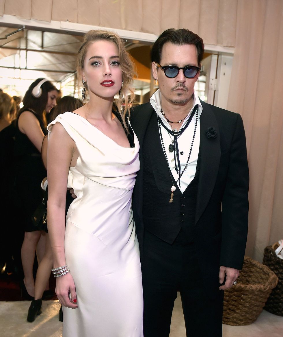 los angeles, ca   january 10  actors amber heard l and johnny depp attend the 8th annual heaven gala presented by art of elysium and samsung galaxy at hangar 8 on january 10, 2015 in los angeles, california  photo by jason kempingetty images