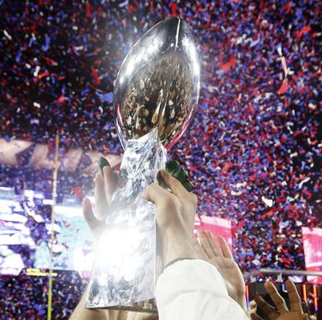 glendale, az february 01 members of the new england patriots celebrate with the vince lombardi trophy after defeating the seattle seahawks 28 24 in super bowl xlix at university of phoenix stadium on february 1, 2015 in glendale, arizona photo by christian petersengetty images