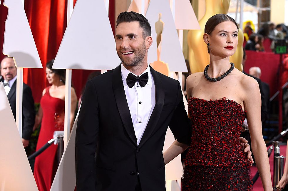 hollywood, ca february 22 singer adam levine l and model behati prinsloo attend the 87th annual academy awards at hollywood highland center on february 22, 2015 in hollywood, california photo by frazer harrisongetty images
