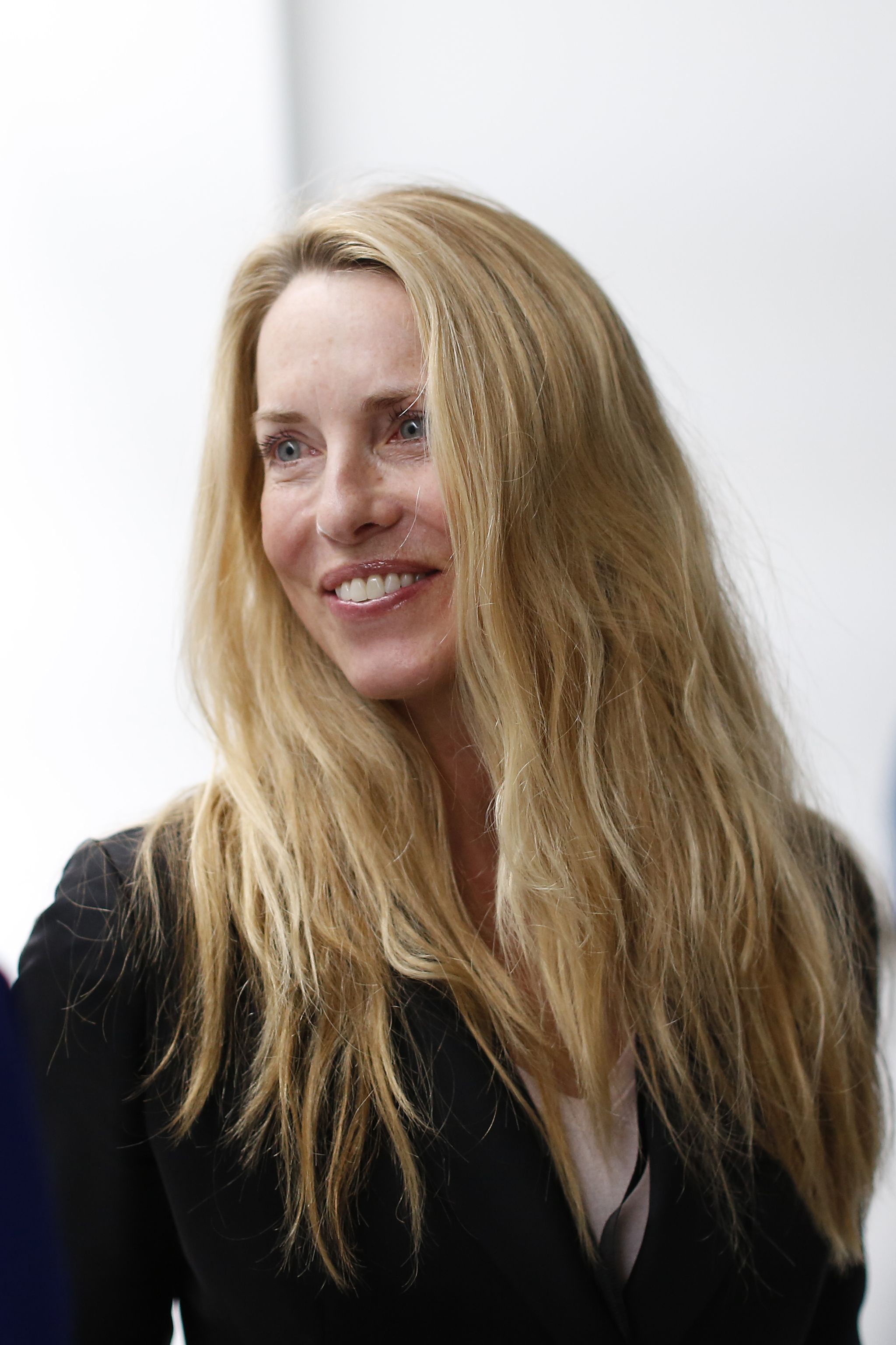 san francisco, ca   march 9  laurene powell jobs, widow of late apple founder and ceo steve jobs, is seen among the crowd after an apple special event at the yerba buena center for the arts on march 9, 2015 in san francisco, california apple inc announced the new macbook as well as more details on the much anticipated apple watch, the tech giants entry into the rapidly growing wearable technology segment as well photo by stephen lamgetty images
