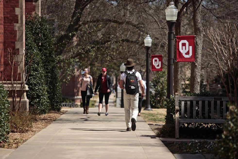 norman, ok   march 11 students walk on campus between clases at the university of oklahoma on march 11, 2015 in norman, oklahoma video showing sigma alpha epsilon members singing a racist chant while traveling on a tour bus went viral after being uploaded to the internet saes national chapter has since suspended the students involved and the university of oklahoma president david boren has terminated the fraternitys affiliation with the school photo by brett deeringgetty images