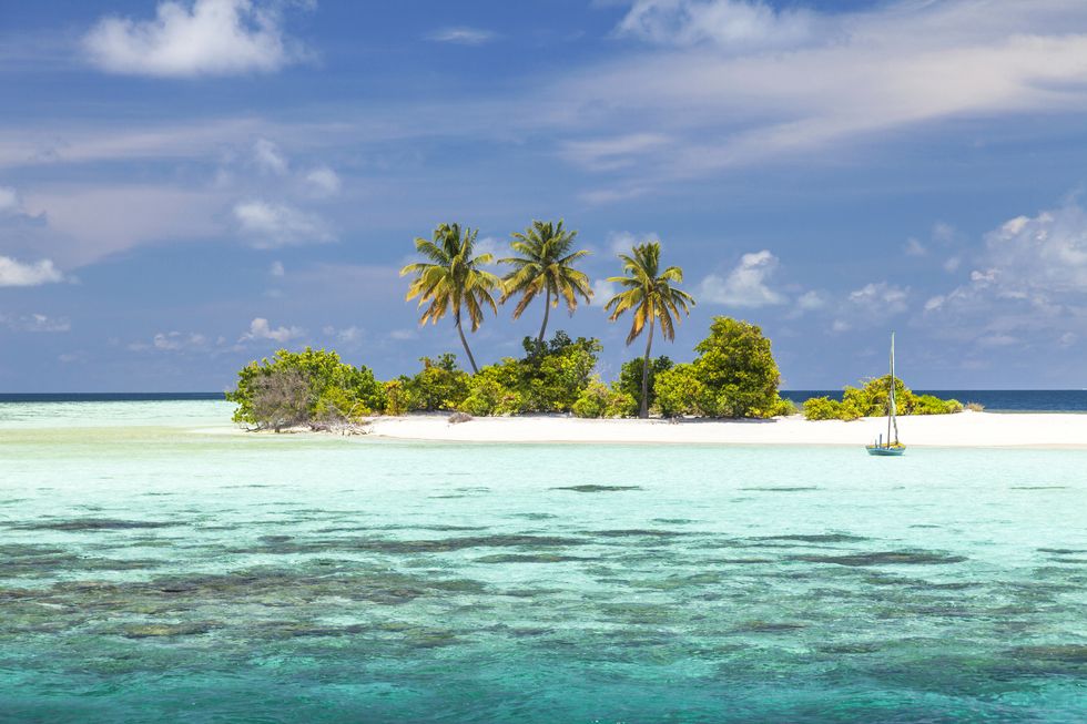 Desert island from dreams with lagoon in Maldives