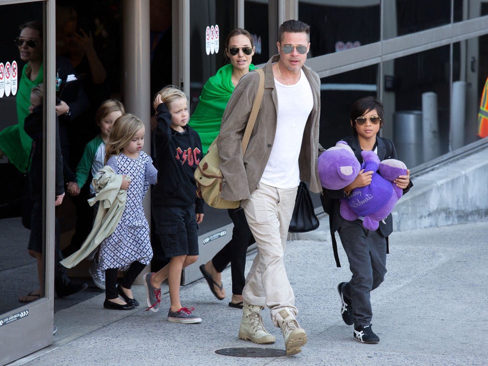 los angeles, ca february 05 brad pitt and angelina jolie are seen after landing at los angeles international airport with their children, pax jolie pitt, shiloh jolie pitt, vivienne jolie pitt and knox jolie pitt on february 05, 2014 in los angeles, california photo by gvkbauer griffingc images