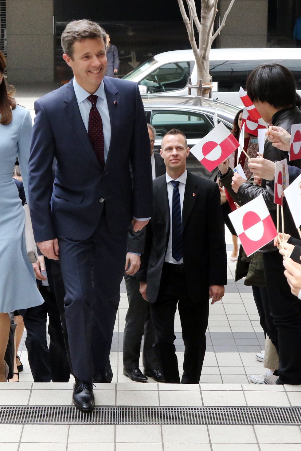 danish crown prince frederik c and crown princess mary centre l arrive at a fashion school to observe a workshop for seal skin fashion products in tokyo on march 28, 2015 the danish royal couple are on a three day visit to promote greenland afp photo yoshikazu tsuno photo credit should read yoshikazu tsunoafp via getty images