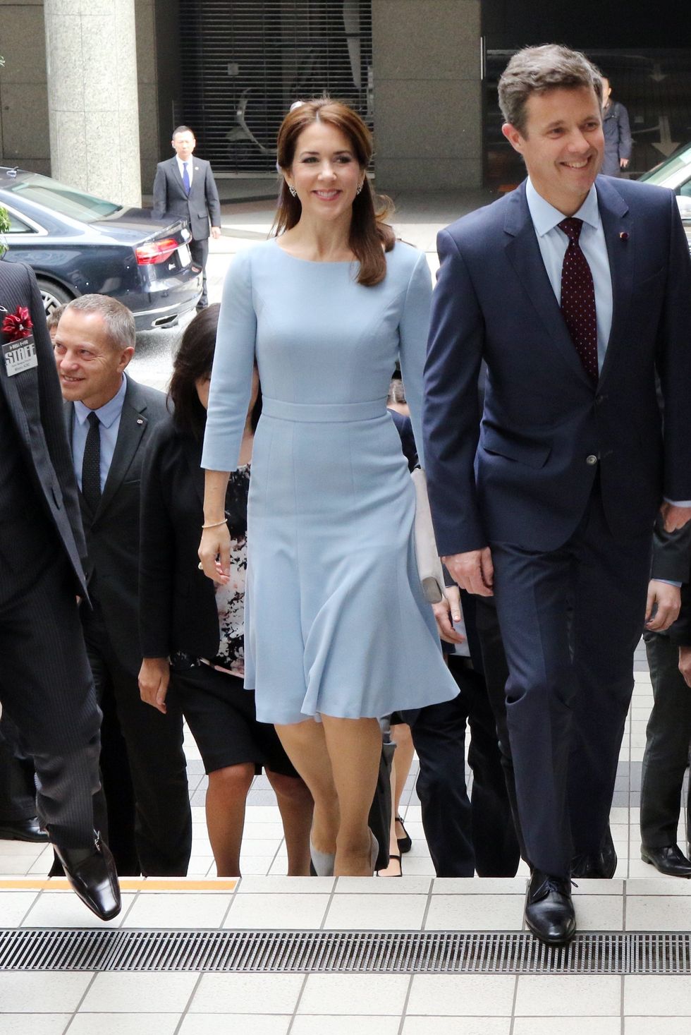 danish crown prince frederik c and crown princess mary centre l arrive at a fashion school to observe a workshop for seal skin fashion products in tokyo on march 28, 2015 the danish royal couple are on a three day visit to promote greenland afp photo yoshikazu tsuno photo credit should read yoshikazu tsunoafp via getty images