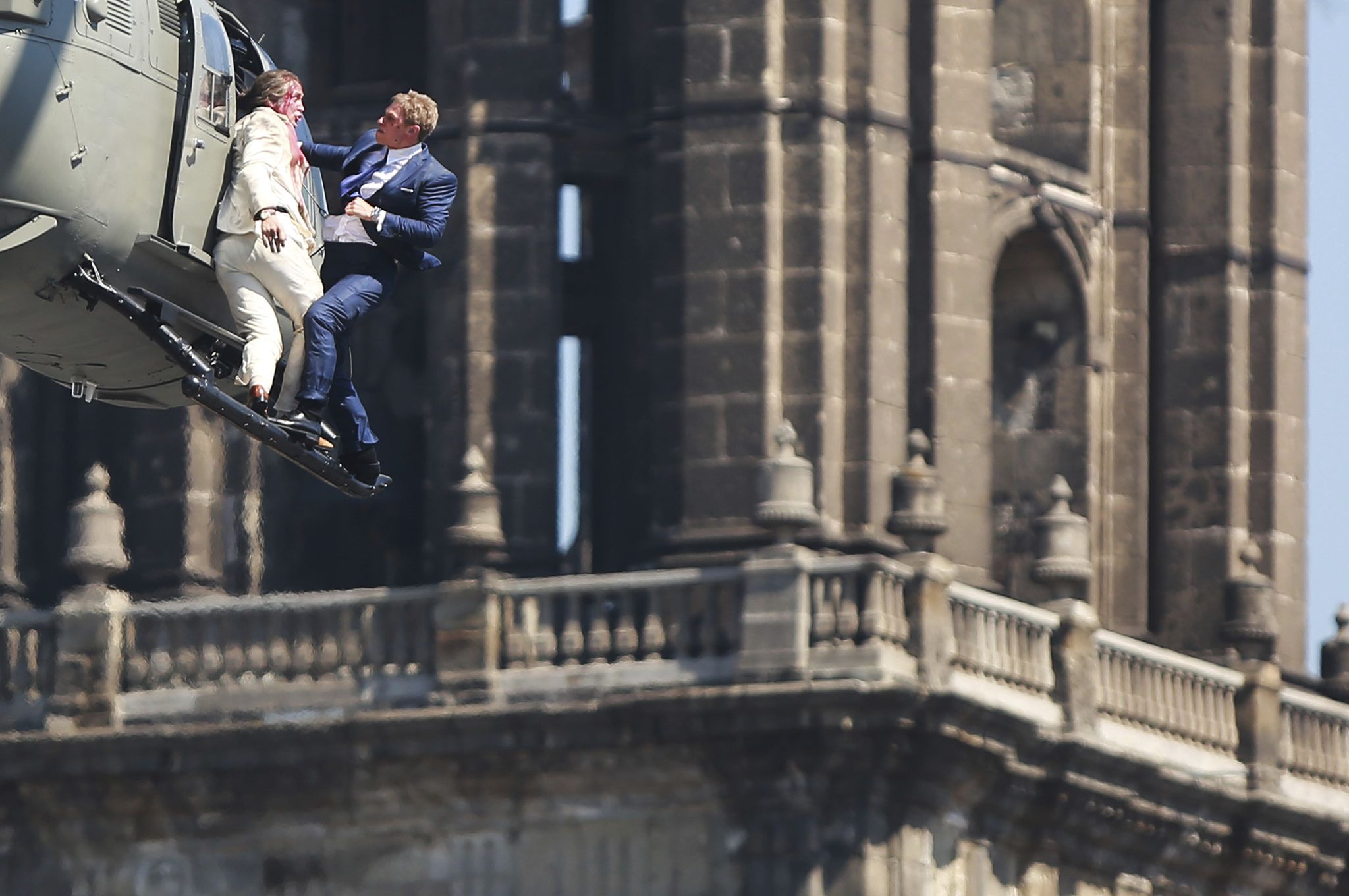 mexico city, mexico   march 31  stuntmen perform a battle hanging from a helicopter during the filming of the latest james bond movie spectre at downtown streets of mexico city on march 31, 2015 in mexico city, mexico photo by hector vivaslatincontent via getty images