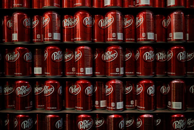 empty cans of dr. pepper soda sit stacked in the warehouse before being filled at the dr. pepper snapple group inc. bottling plant in louisville, kentucky, u.s., on tuesday, april 21, 2015. dr. pepper snapple group inc., producers of 7up and aw root beer, is scheduled to release earnings figures on april 23. photographer: luke sharrett/bloomberg via getty images