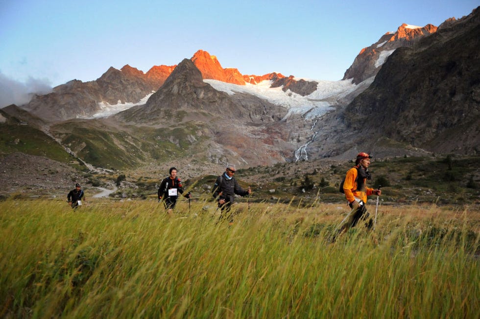 participants compete in the 7th edition of the north face ultra trail, considered as one of the hardest countryside trail races winding up and around the mont blanc, on august 29, 2009, near the combal lake, in chamonix, french alps the athletes have to cover a distance of 166 kms within 46 hours, with 9400 meters of inclines and pass through france, italy and switzerland afp photo jean pierre clatot photo by jean pierre clatot afp photo by jean pierre clatotafp via getty images