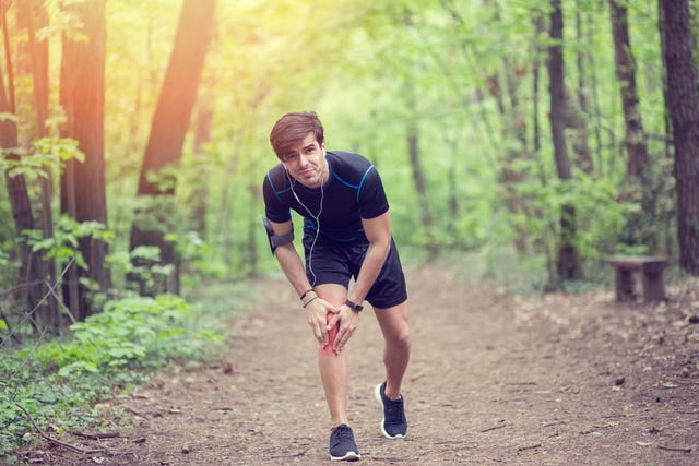 young man with pain in the knee after workout