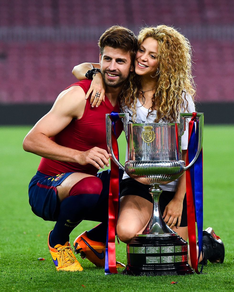 barcelona, spain may 30 gerard pique of fc barcelona and shakira pose with the trophy after fc barcelona won the copa del rey final match against athletic club at camp nou on may 30, 2015 in barcelona, spain photo by david ramosgetty images