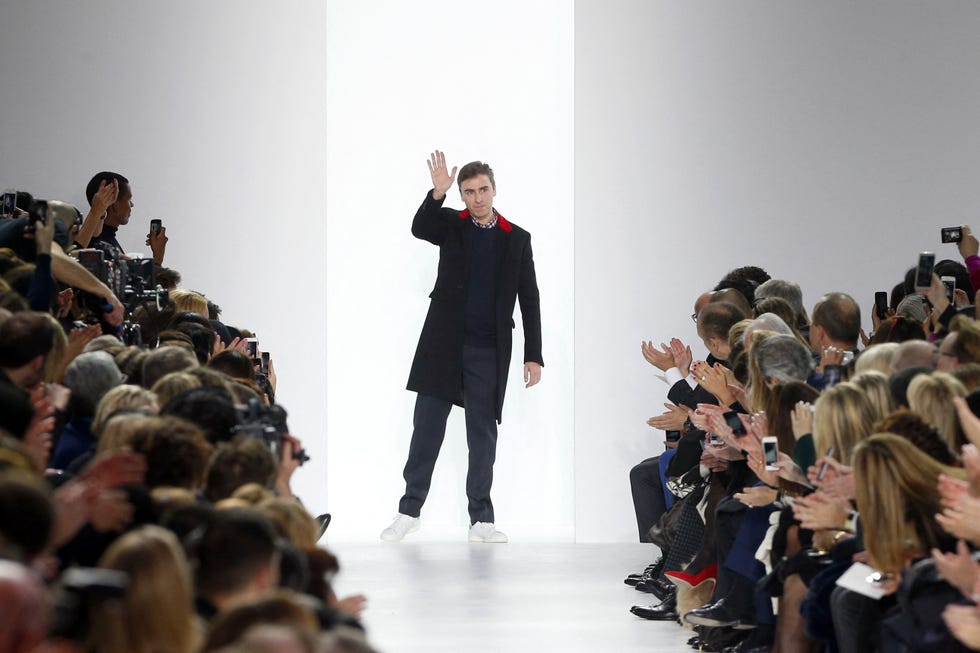 belgian fashion designer raf simons for christian dior acknowledges the audience at the end of the 2014/2015 autumn/winter ready to wear collection fashion show, on february 28, 2014 in paris. afp photo / francois guillot (photo by francois guillot / afp) (photo by francois guillot/afp via getty images) 