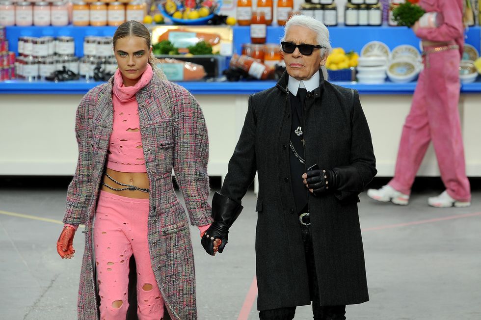 paris, france march 04 fashion designer karl lagerfeld and model cara delevingne appear at the end of the runway during the chanel show as part of the paris fashion week womenswear fallwinter 2014 2015 on march 4, 2014 in paris, france photo by francois durandgetty images