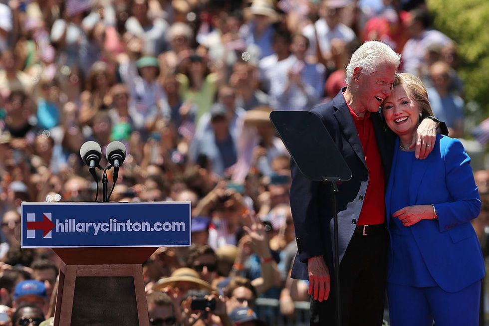 new york, ny june 13 people cheer after democratic presidential candidate hillary clinton stands on stage with her husband former president bill clinton after her official kickoff rally at the four freedoms park on roosevelt island in manhattan on june 13, 2015 in new york city the long awaited speech at a historical location associated with the values franklin d roosevelt outlined in his 1941 state of the union address, is the democratic the candidateÕs attempt to define the issues of her campaign to become the first female president of the united states photo by spencer plattgetty images