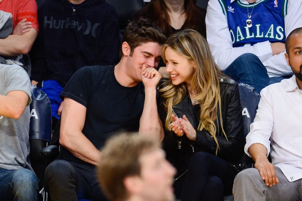 los angeles, ca   april 04  zac efron and halston sage attend a basketball game between the dallas mavericks and the los angeles lakers at staples center on april 4, 2014 in los angeles, california  photo by noel vasquezgc images