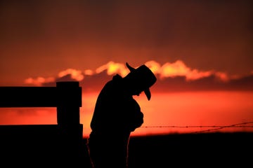 a cowboy with his head down additional themes include depression, tired, sad, sadness, western, wild west, dude ranch, relaxing, sleeping, silhouettes, and side view image was taken near high river, alberta on the western plains the western way of life is embedded into the culture of southern alberta the calgary stampede, an event dubbed the greatest show on earth, is located just half an hour north of high river image was taken with canon mark ii camera body with l series lens