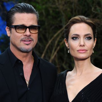london, england   may 08  brad pitt and angelina jolie attend a private reception as costumes and props from disneys maleficent are exhibited in support of great ormond street hospital at kensington palace on may 8, 2014 in london, england  photo by anthony harveygetty images