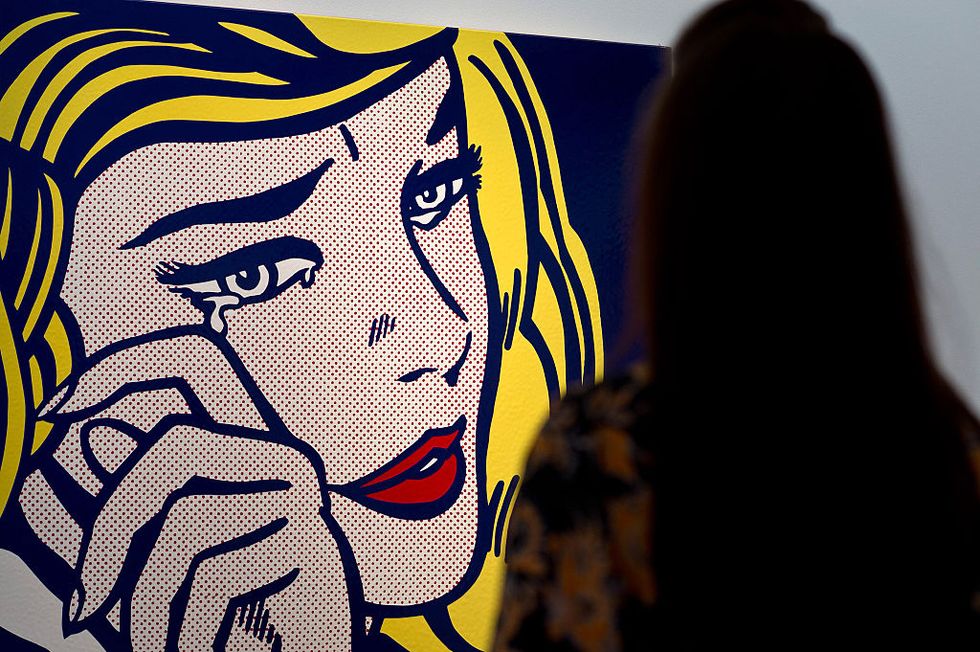 london, england   october 09  a guest views crying girl by artist roy lichtenstein during the preview ahead of the artists muse a curated evening sale at christies new york on october 9, 2015 in london, england the impressionist, modern, post war and contemporary works will be on show to the public between october 10 and october 17 and includes amedeo modiglianis nu couche which is estimated to sell for 100 usd million the sale also showcases pieces by artists including lucian freud, paul cezanne, peter doig, pablo picasso, alberto giacometti, amedeo modigliani and roy lichtenstein  photo by ben pruchniegetty images