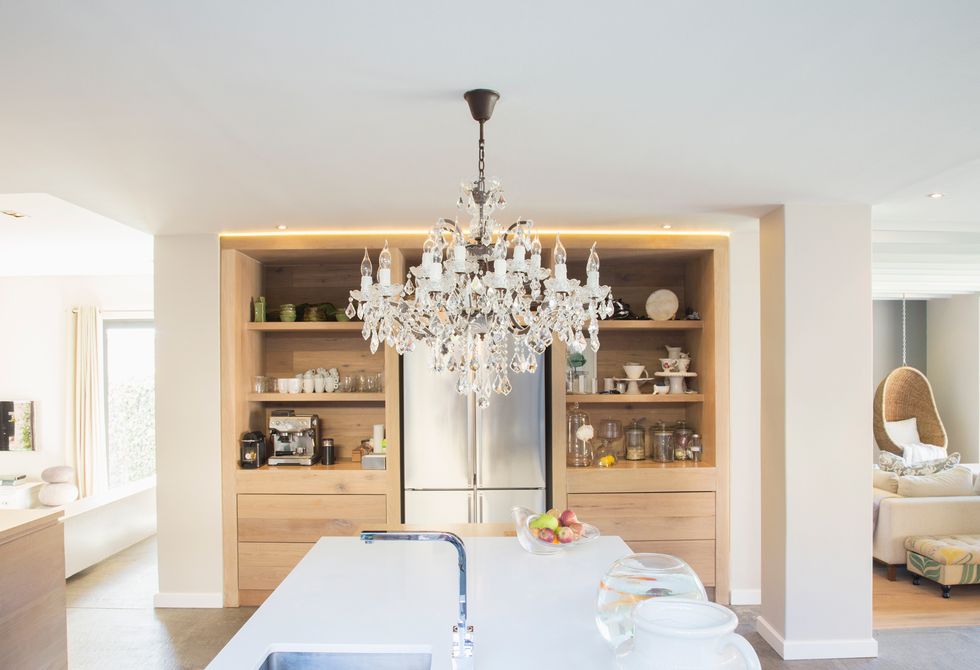 a kitchen with a chandelier
