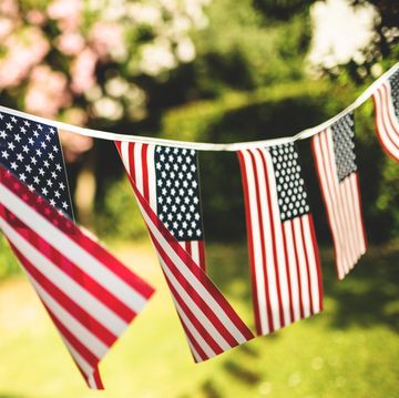 american flags strung together and handing in outdoor area
