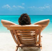 man relaxing on beach, ocean view, maldives island