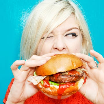 woman eating hamburger