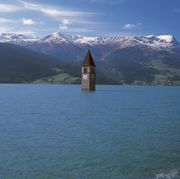 italy   april 28 the old bell tower 14th century of curon venosta church rising out of the waters of the artificial lake of resia, trentino alto adige, italy photo by deagostinigetty images