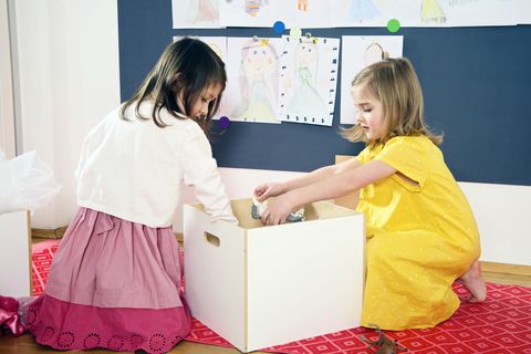 Two Girls Playing in Nursery