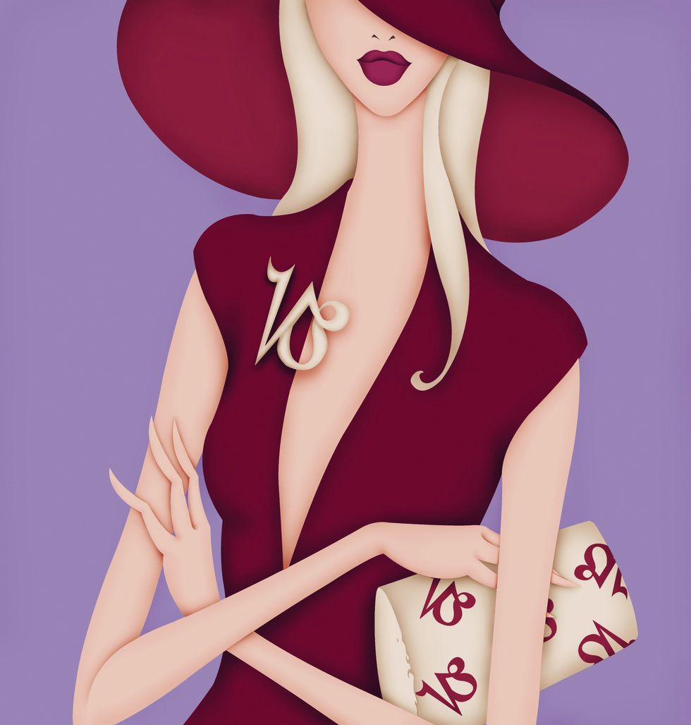 Glamorous woman with brooch and purse with Capricorn symbol