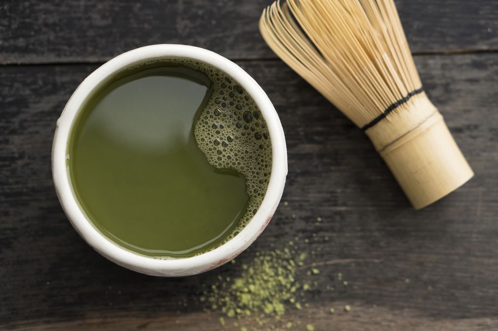 Green Matcha Tea in cup with Cha-sen