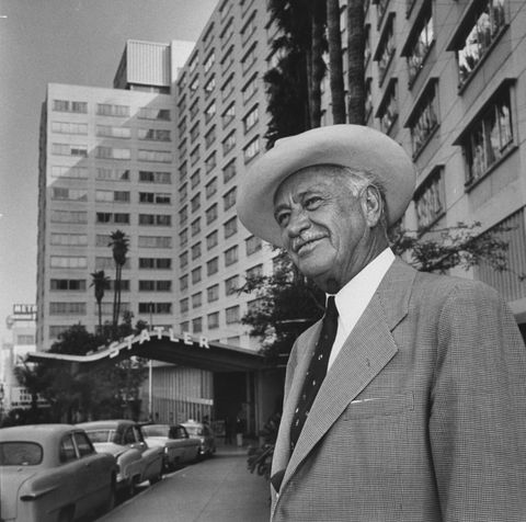conrad n hilton standing in front of the los angeles statler  photo by j r eyermanthe life picture collection via getty images