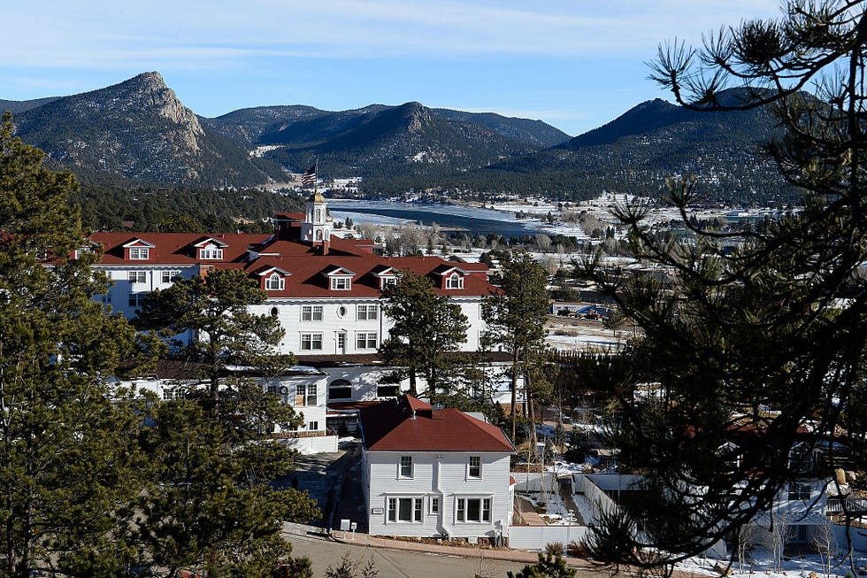 the stanley hotel is pictured from high above in estes park, colorado