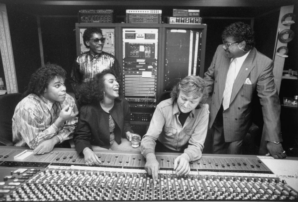 Brad Howell (R) & John Davis (2L), who lip-synced for the fakes, w. Gina Mohammed (3L), Ray Horton (L) and their producer Frank Farian (2R) posing at control board in recording studio